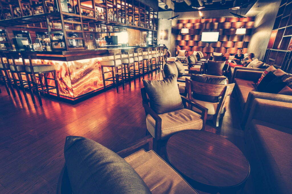 a bar with a table and chairs