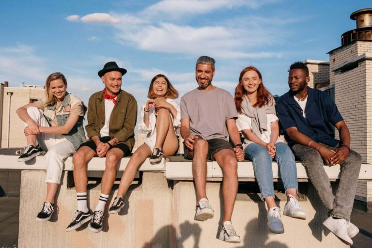a group of people sitting on a bench