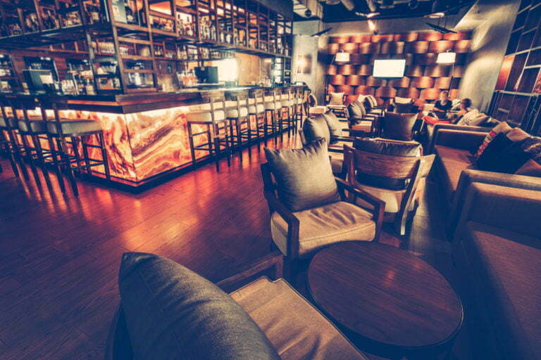 a bar with a table and chairs
