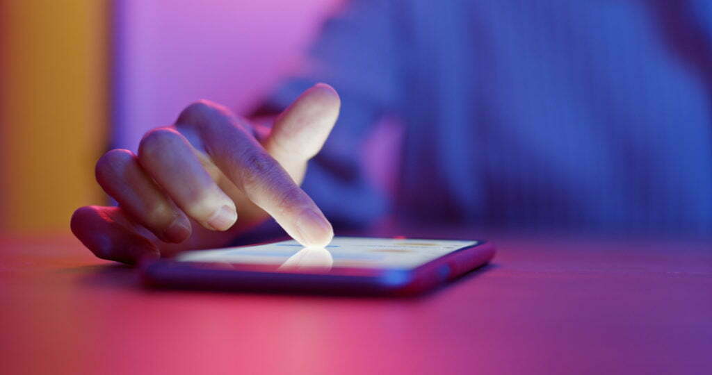 a hand on a phone