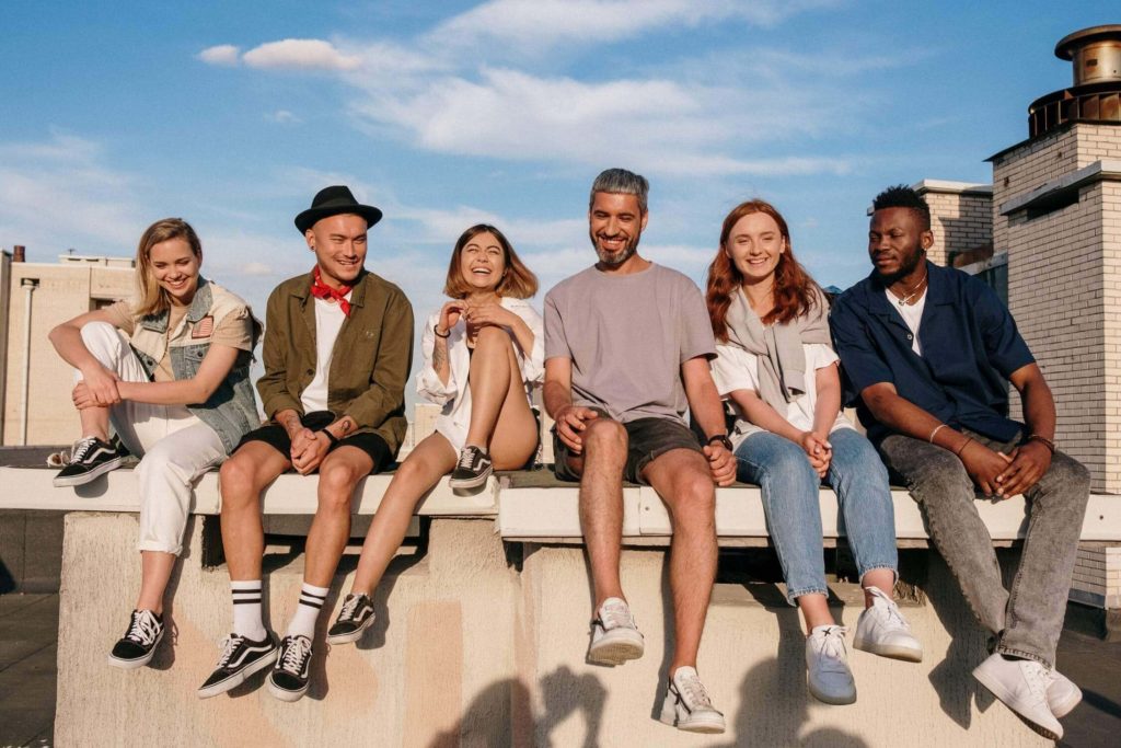 a group of people sitting on a bench
