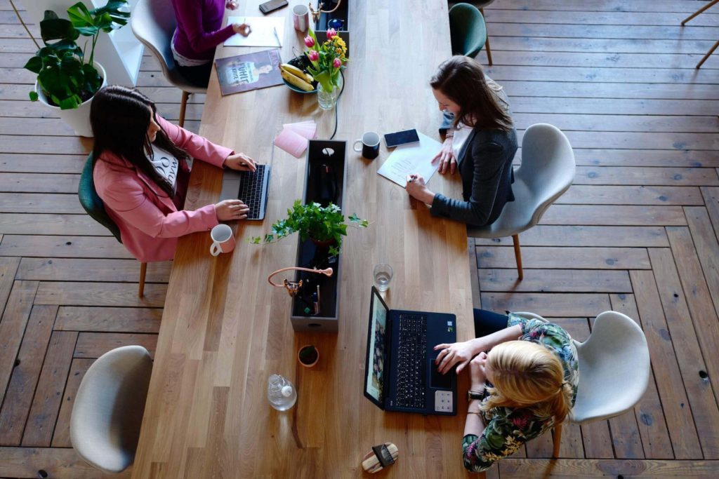 a group of people sitting on the floor