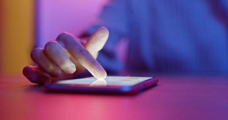 a hand on a phone